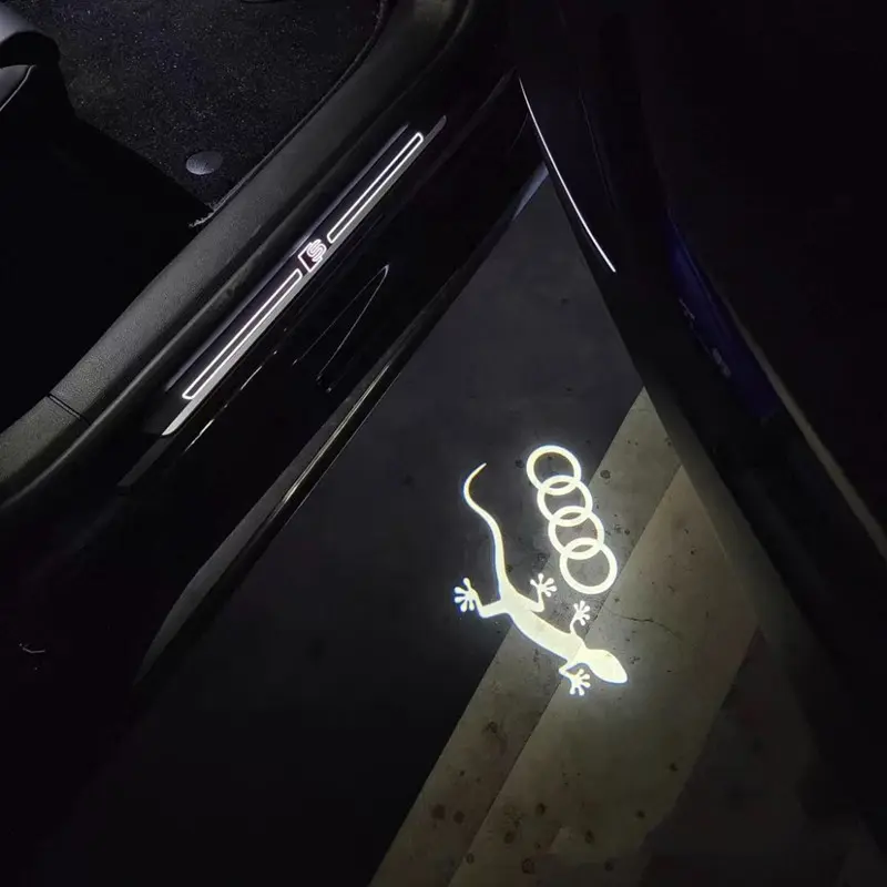 audi gecko puddle lights Audi Gecko puddle lights projecting the iconic Quattro lizard logo in bright white LED onto the pavement.