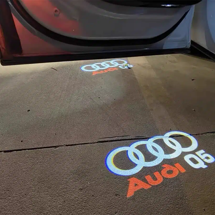 audi q5 puddle lights Audi Q5 puddle lights projecting logo onto ground as SUV door opens, premium UK automotive accessory