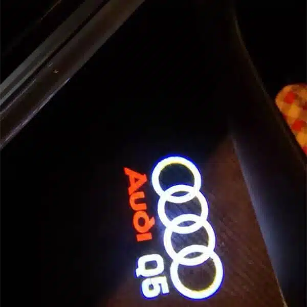 audi q5 puddle lights Sleek Audi Q5 puddle lights displaying logo on wet street surface, ideal for UK night driving conditions