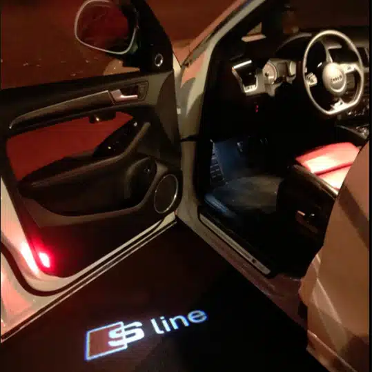 audi s line puddle lights Pair of LED Audi S Line shadow lights with high-definition glass projector lenses for car doors.