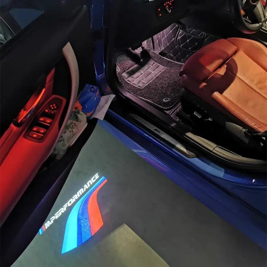 M Sport Puddle Lights The BMW logo prominently featured on a car door, symbolizing the brand's heritage in luxury vehicles.