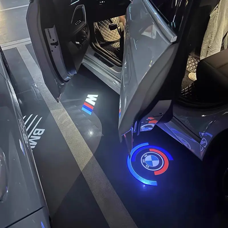 BMW 50th Anniversary Door Lights BMW 50th Anniversary door lights projecting the vintage M Heritage logo with blue, violet, and red circles.
