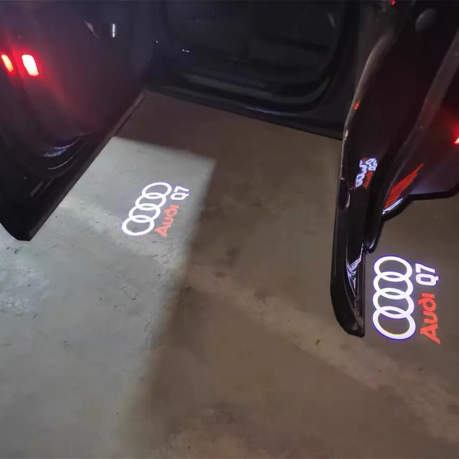 Audi Q7 Puddle Lights Audi Q7 puddle lights projecting logo onto ground as SUV door opens, premium UK market accessory