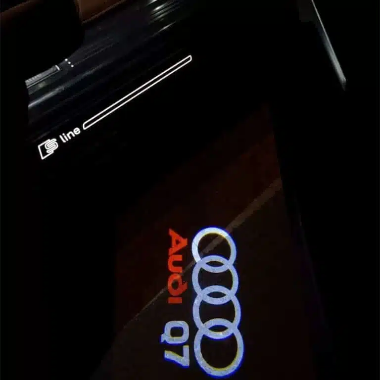 Audi Q7 Puddle Lights Luxury Audi Q7 puddle lights displaying logo on wet street surface, ideal for UK night driving conditions