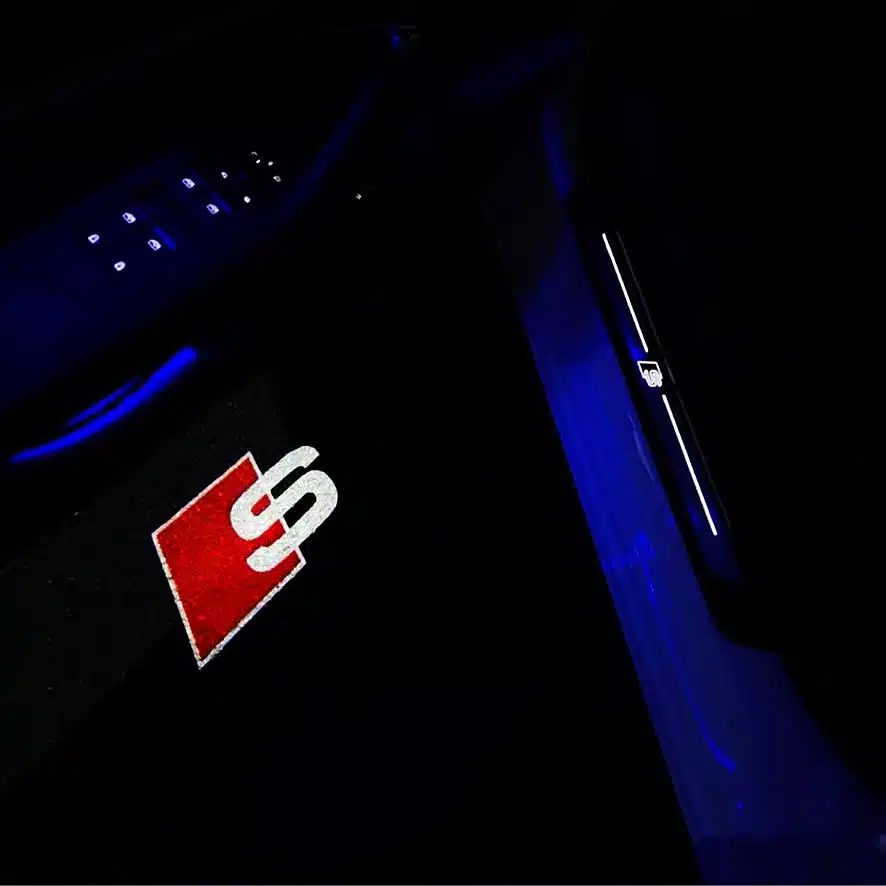 Audi S Puddle Lights Audi S shadow lights illuminating the pavement with a bright LED emblem from the car door.